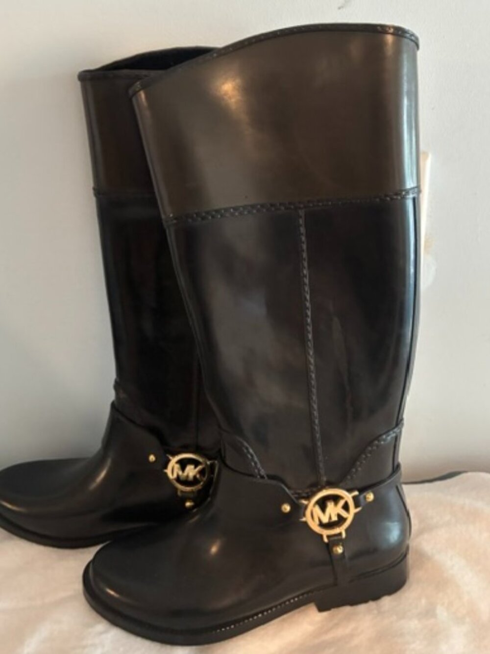 Beautiful Michael Kors rain boots, with gold hardware, size 7.